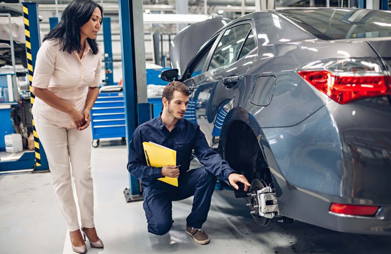 a technician explaining the nitty-gritty to the customer